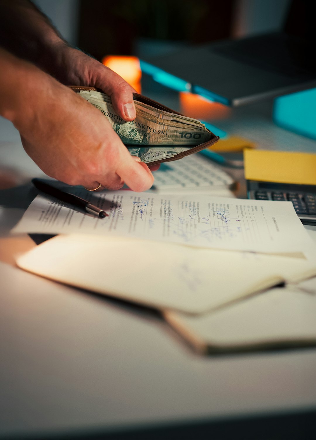 services-03 Hand wallet Polish money business documents Close-up hands holding wallet full Polish currency